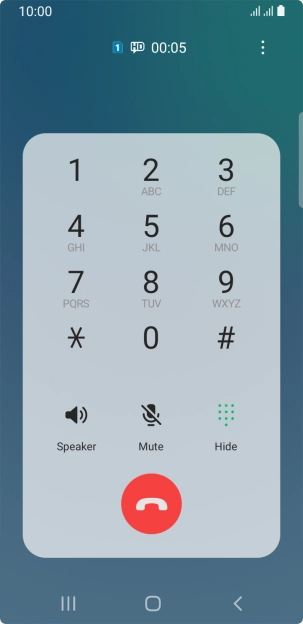 Press the end call icon.