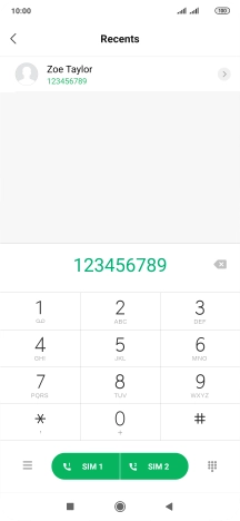 Key in the required number and press the call icon next to the required SIM.