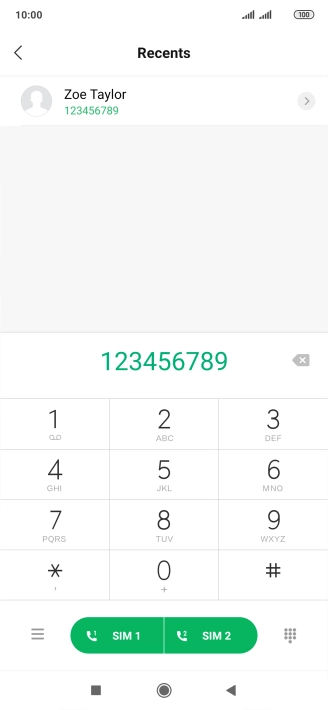 Key in the required number and press the call icon next to the required SIM.