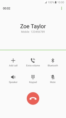 Press the end call icon.