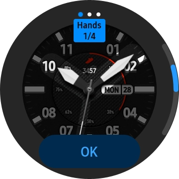 Slide your finger right or left on the screen and use the Rotating bezel to change between the different designs.