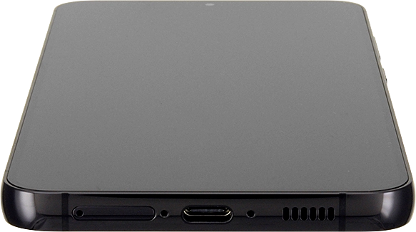 Insert the opener into the small hole in the SIM holder.