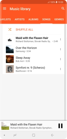 Press the song title at the bottom of the screen.