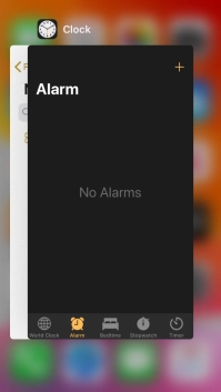 Slide upwards on the required application to end it.