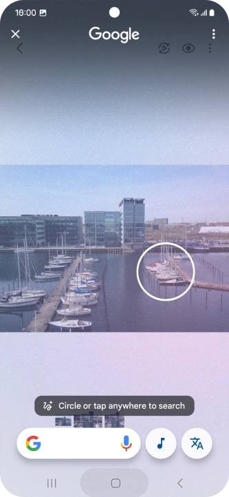 Draw a circle around the required object on the picture and wait for the search results.