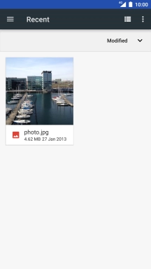 Slide your finger right starting from the left side of the screen.