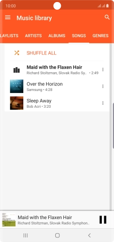 Press the song title at the bottom of the screen.