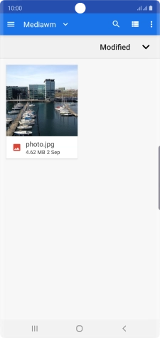 Slide your finger right starting from the left side of the screen.