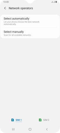 Press Select manually and your phone will search for networks.