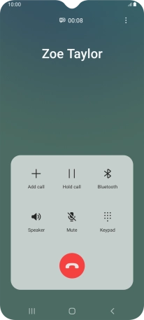 Press the end call icon.