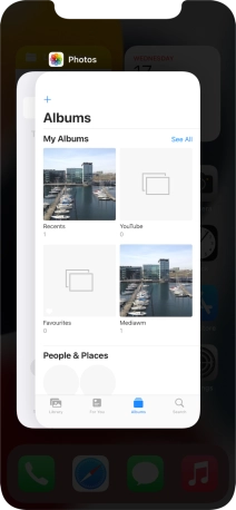Slide upwards on the required application to end it.