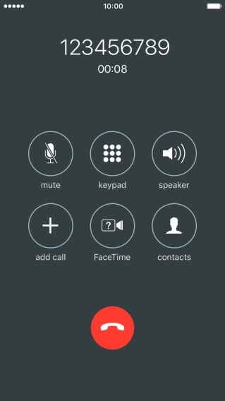 Press the end call icon.