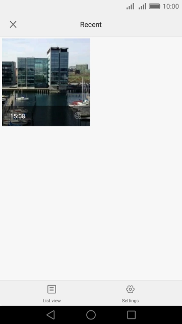 Slide your finger right starting from the left side of the screen.