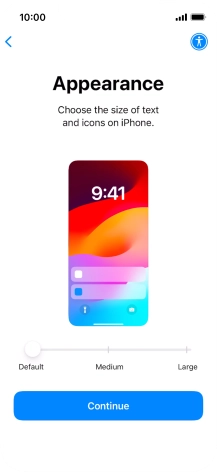 Select the required text and icon size on your phone and press Continue.