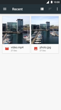 Slide your finger right starting from the left side of the screen.