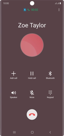 Press the end call icon.