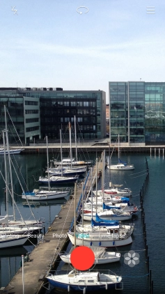 If the video camera is turned on, press Photo.