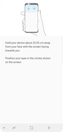 Follow the instructions on the screen to create the phone lock code using iris scanning.