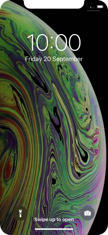 Slide your finger upwards starting from the bottom of the screen.