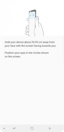 Follow the instructions on the screen to create the phone lock code using iris scanning.