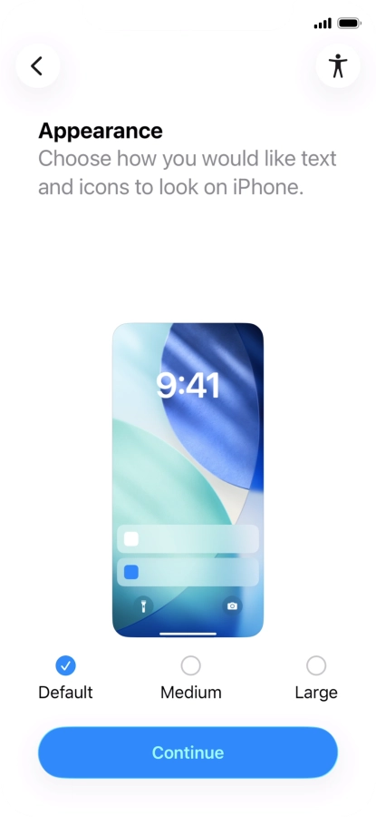 Select the required text and icon size on your phone and press Continue.