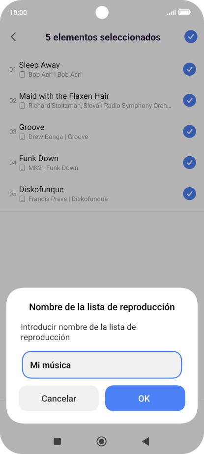 Introduce el nombre deseado de la lista de reproducción y pulsa OK.