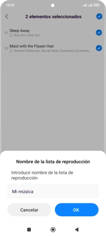 Introduce el nombre deseado de la lista de reproducción y pulsa OK.