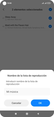 Introduce el nombre deseado de la lista de reproducción y pulsa OK.