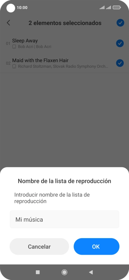 Introduce el nombre deseado de la lista de reproducción y pulsa OK.