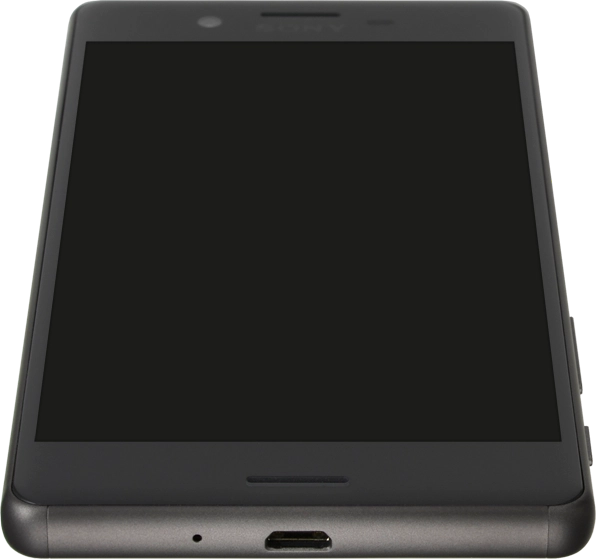 Conecta el cargador o el cable de datos al conector y a una toma de corriente o al puerto USB del ordenador.