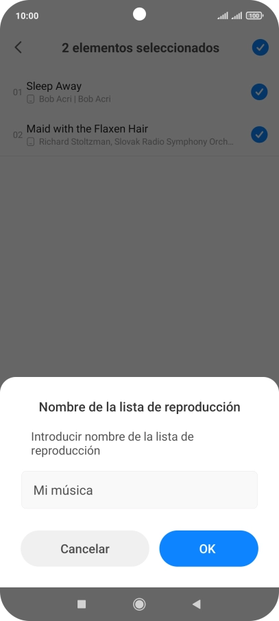 Introduce el nombre deseado de la lista de reproducción y pulsa OK.