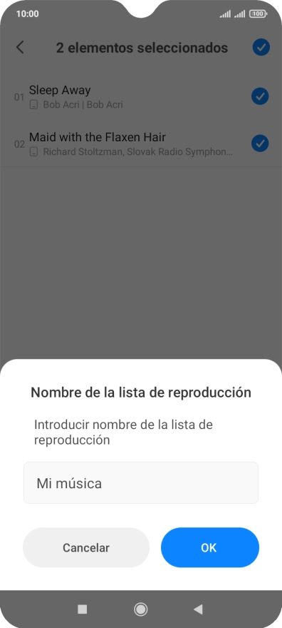Introduce el nombre deseado de la lista de reproducción y pulsa OK.