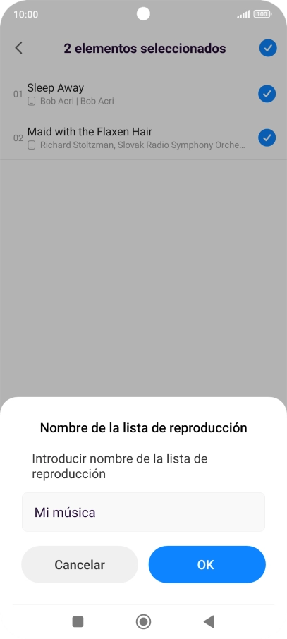 Introduce el nombre deseado de la lista de reproducción y pulsa OK.