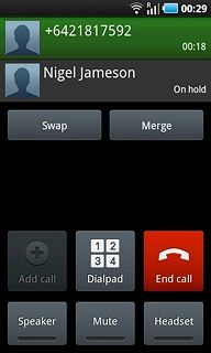 Make sure the call you want to end is active.Press End call.The active call is ended and the call on hold is automatically activated.
