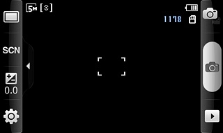 Press the scene mode icon second from the top at the left side of the display.