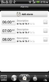 Press the alarm icon.