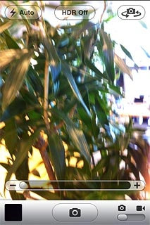 To zoom in or out:Press anywhere on the display.Press + or - to zoom in or out.