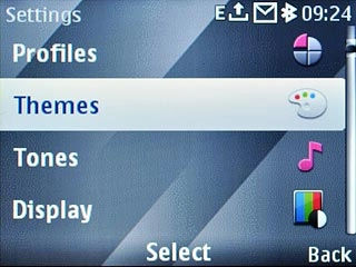 Scroll to Themes and press the Navigation key.