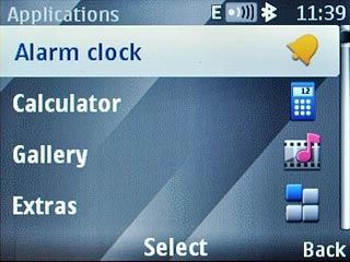Scroll to Alarm clock and press the Navigation key.