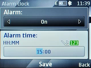 Scroll to Alarm time and key in the required alarm time.