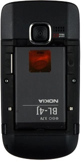 Take hold of the top of the battery and remove it.