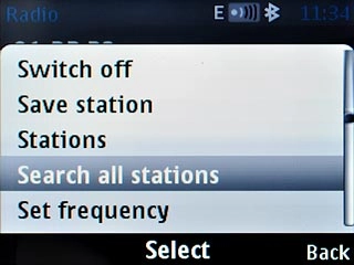 Scroll to Search all stations and press the Navigation key.
