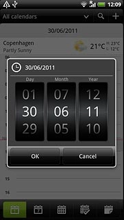 Slide the numbers up or down to select the date.