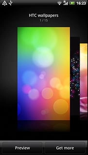 Slide your finger right or left on the display to select the required background image.