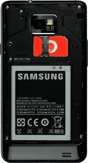 Take hold of the bottom of the battery and remove it.