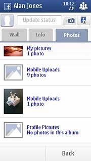 Press the Photos tab.Follow the instructions on the display to view your pictures.