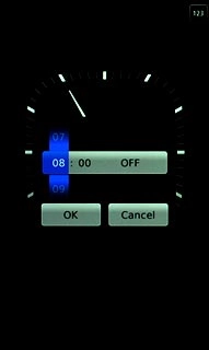 Press anywhere on the display.Slide hours and minutes up or down to set the time for the alarm.
