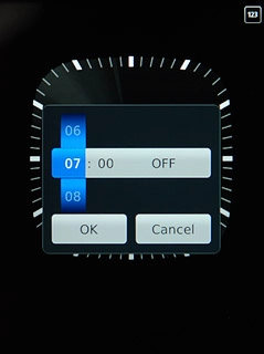 Press anywhere on the display.Slide hours and minutes up or down to set the time for the alarm.