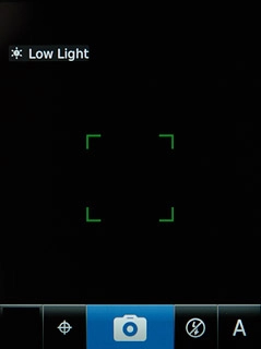 Press the camera icon to take the picture.Follow the instructions on the display to key in text and select a photo album.