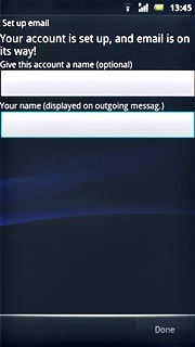 Press the field below Your name (displayed on outgoing messag.) and key in the required sender name.